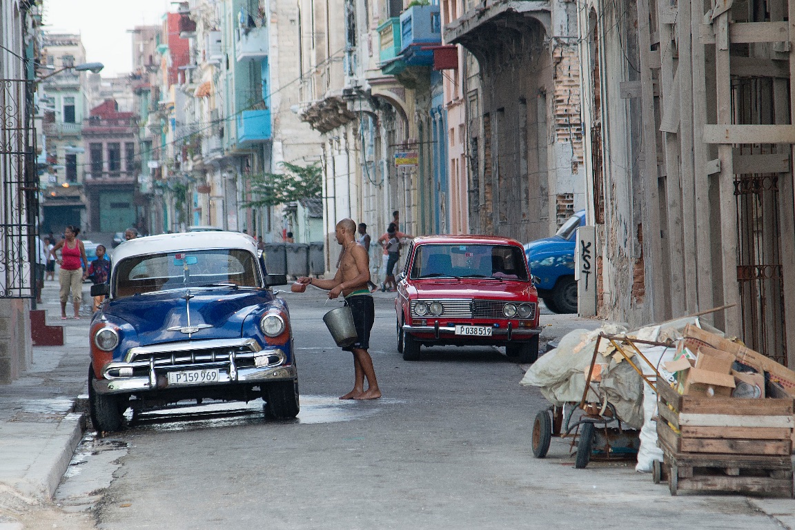 Havana. Washing the "almendrón" (as they call the old cars)